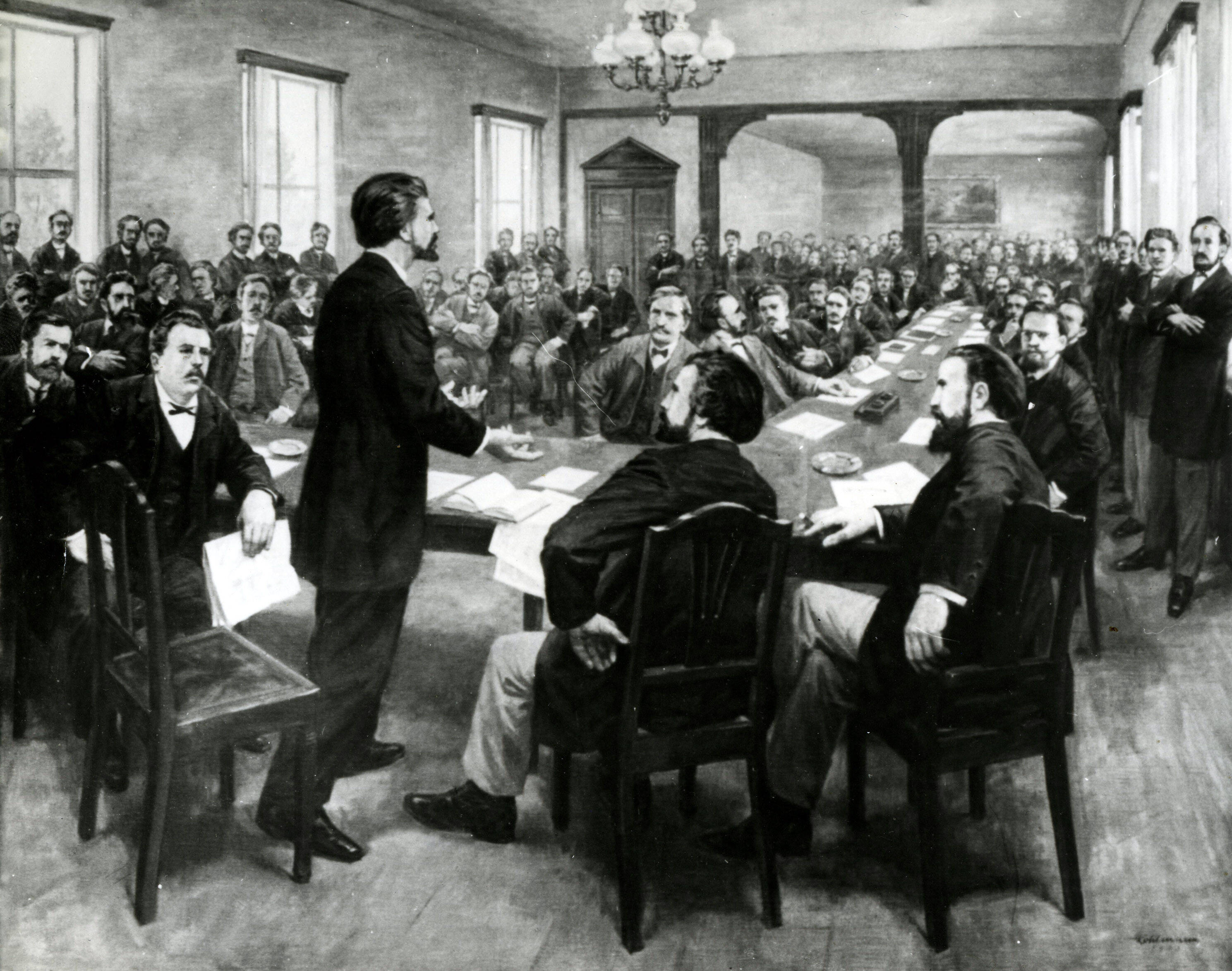 Historisches Schwarz-Weiß-Gemälde zeigt August Bebel redend beim Parteitag in Gotha 1875