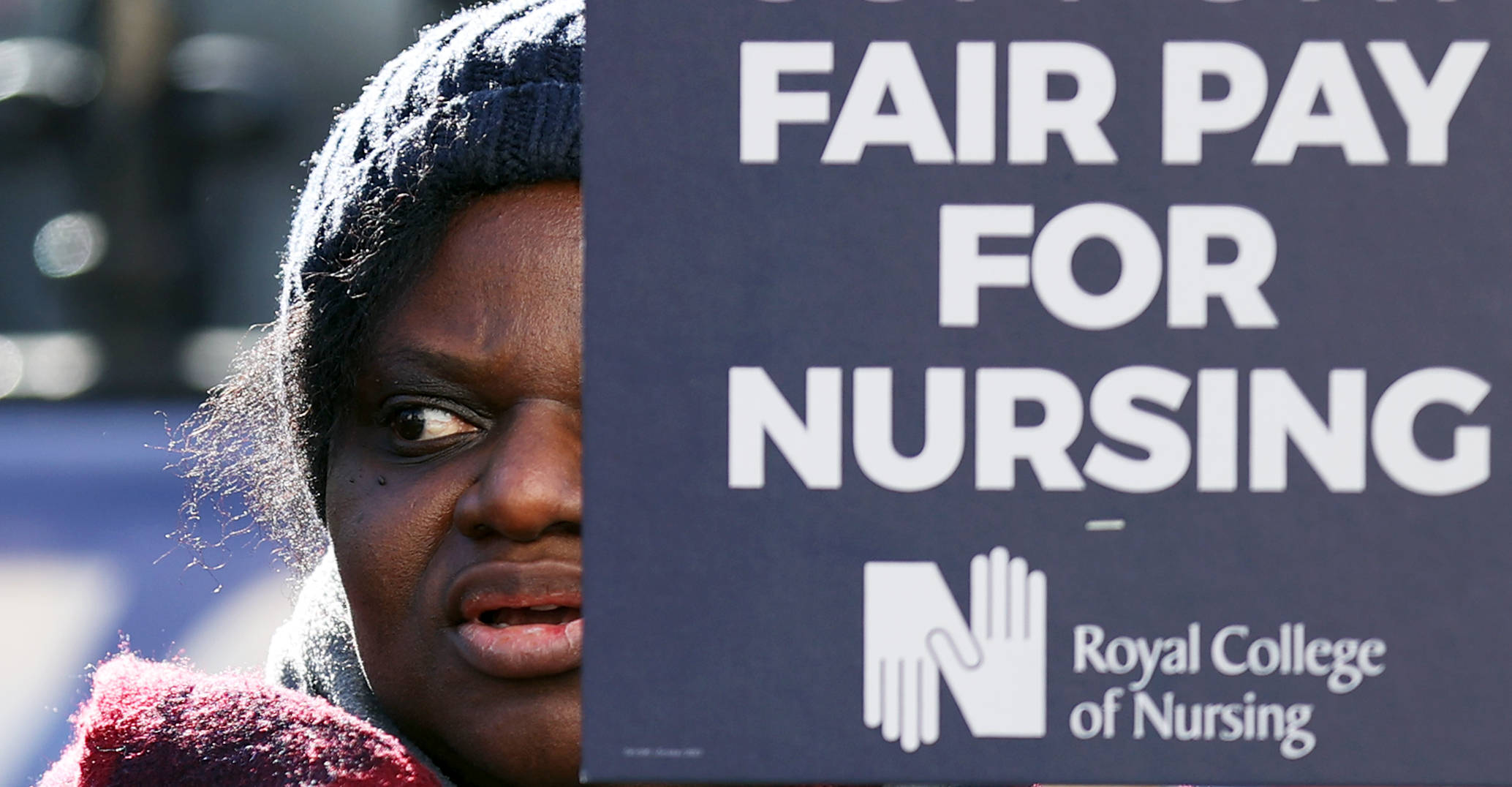 A healthcare worker protests in central London.